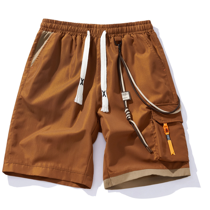 Black cargo shorts elastic drawcord contrast orange accents lightweight streetwear style urban fit