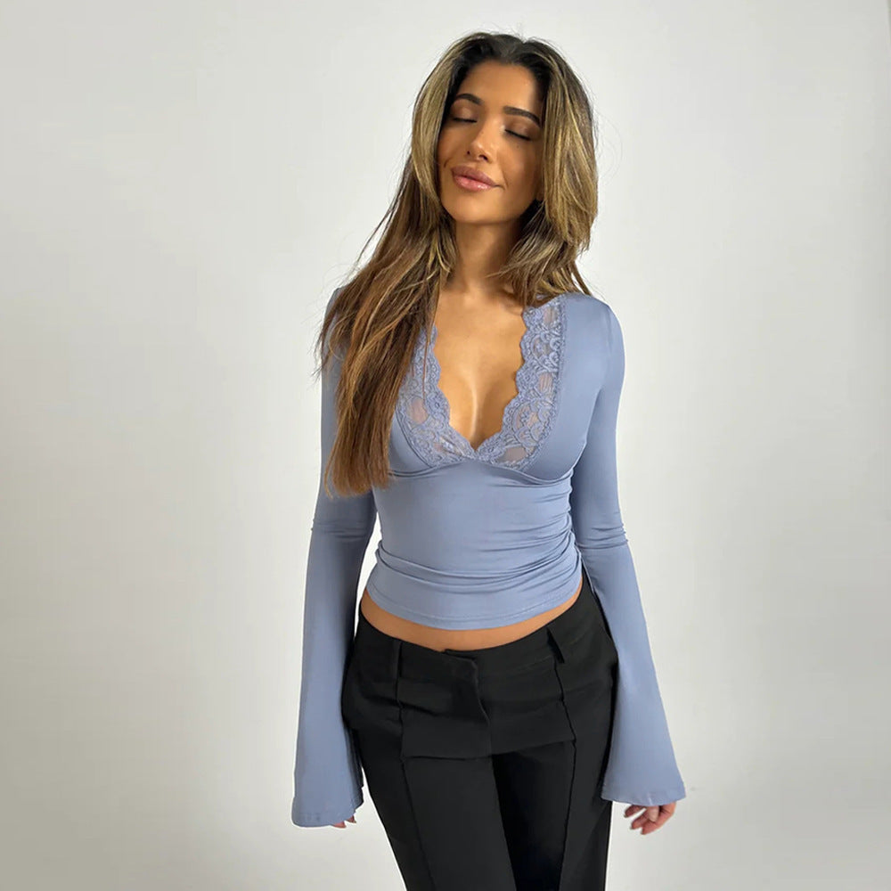 Fiorenza white V-neck blouse with dramatic flare sleeves, elegant flattering fit for women