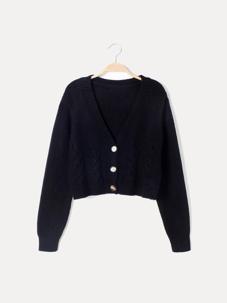 Women's cream cable knit crop sweater with V-neck button placket, cropped waist silhouette