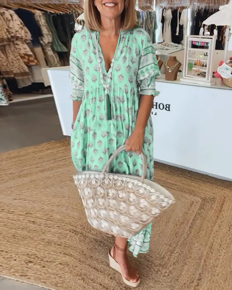 Women's bold print V-neck half-sleeve dress with flattering silhouette for everyday chic