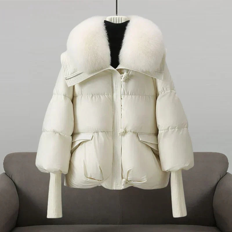Women's short black puffer jacket with sleek contemporary fit and cozy insulated warmth