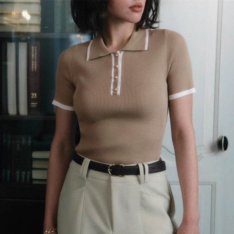 Ivory ribbed knit top with tailored lapel collar and gold button detail, slim structured silhouette