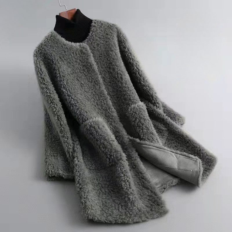 Women's ivory faux shearling coat with satin-like shell, plush texture, and luxurious velvet-soft finish