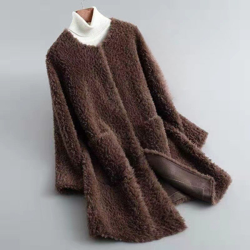 Women's ivory shearling coat with satin-wrapped finish, plush faux fur texture, and luxurious drape