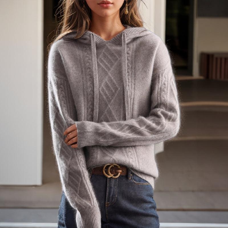 Women's ivory cable knit hooded pullover with adjustable drawstring hood, luxuriously soft wool blend