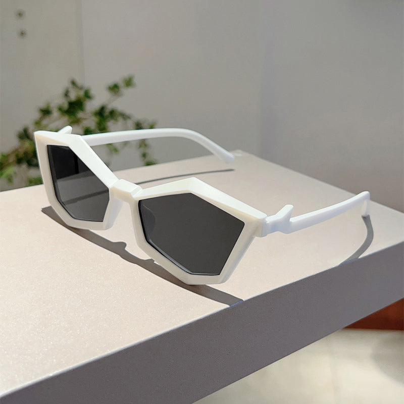 Women's silver geometric frame sunglasses with angular polycarbonate design and clear UV-protective lenses