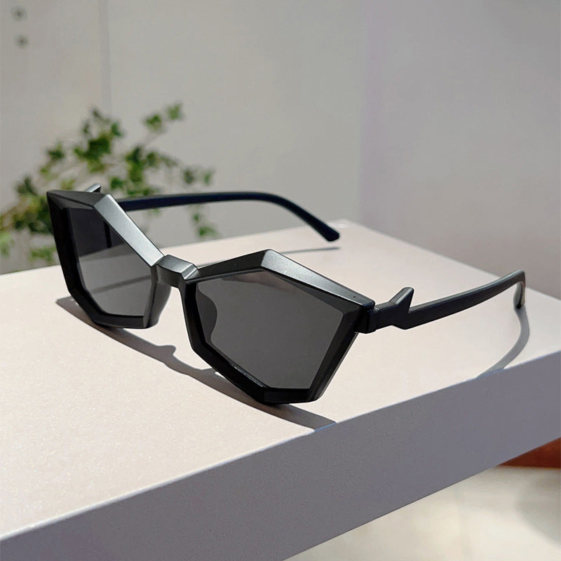 Women's silver geometric frame sunglasses with angular polycarbonate design and clear UV-protective lenses