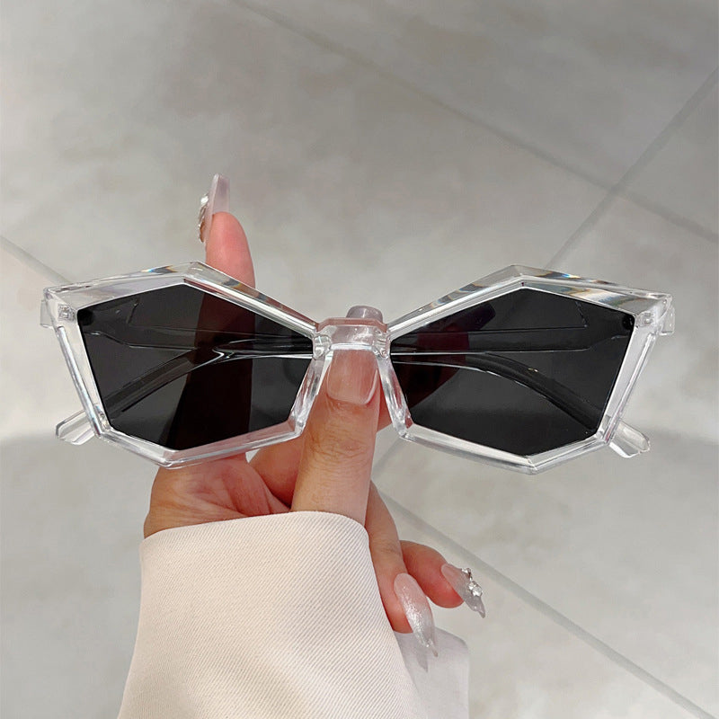 Women's silver geometric frame sunglasses with angular polycarbonate design and clear UV-protective lenses