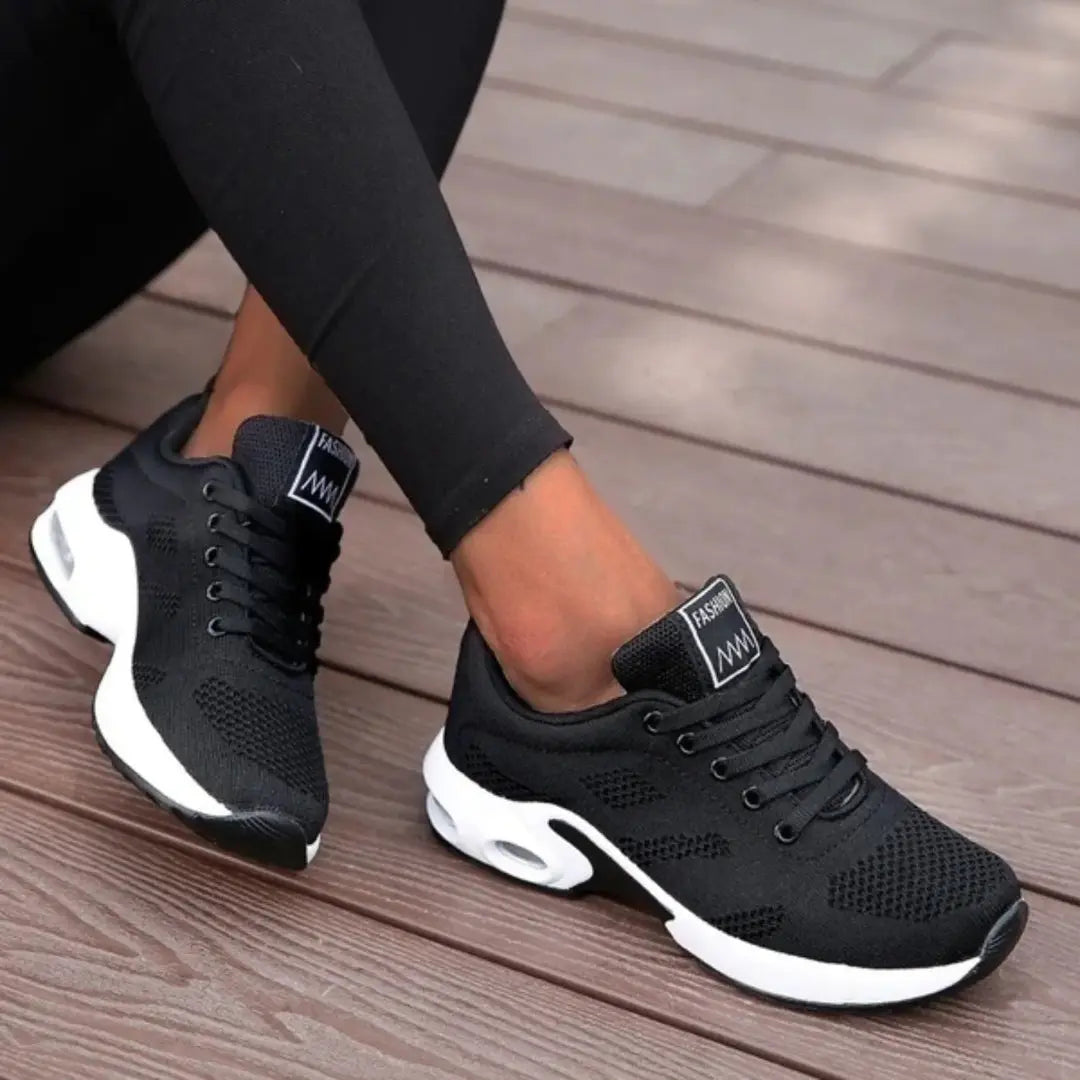 Women's white mesh orthopedic sneakers with air cushion sole and breathable lightweight athletic design