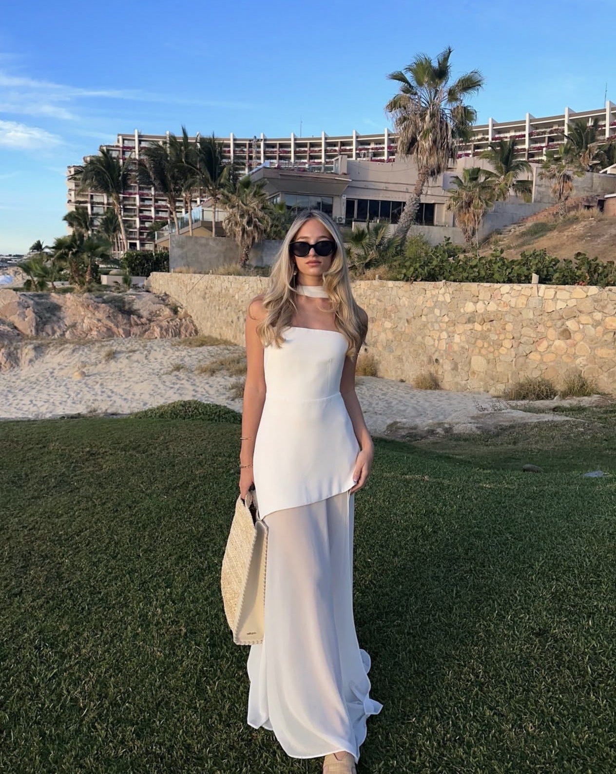 Ivory strapless asymmetrical maxi dress with sheer overlay and detachable neck tie for evening events