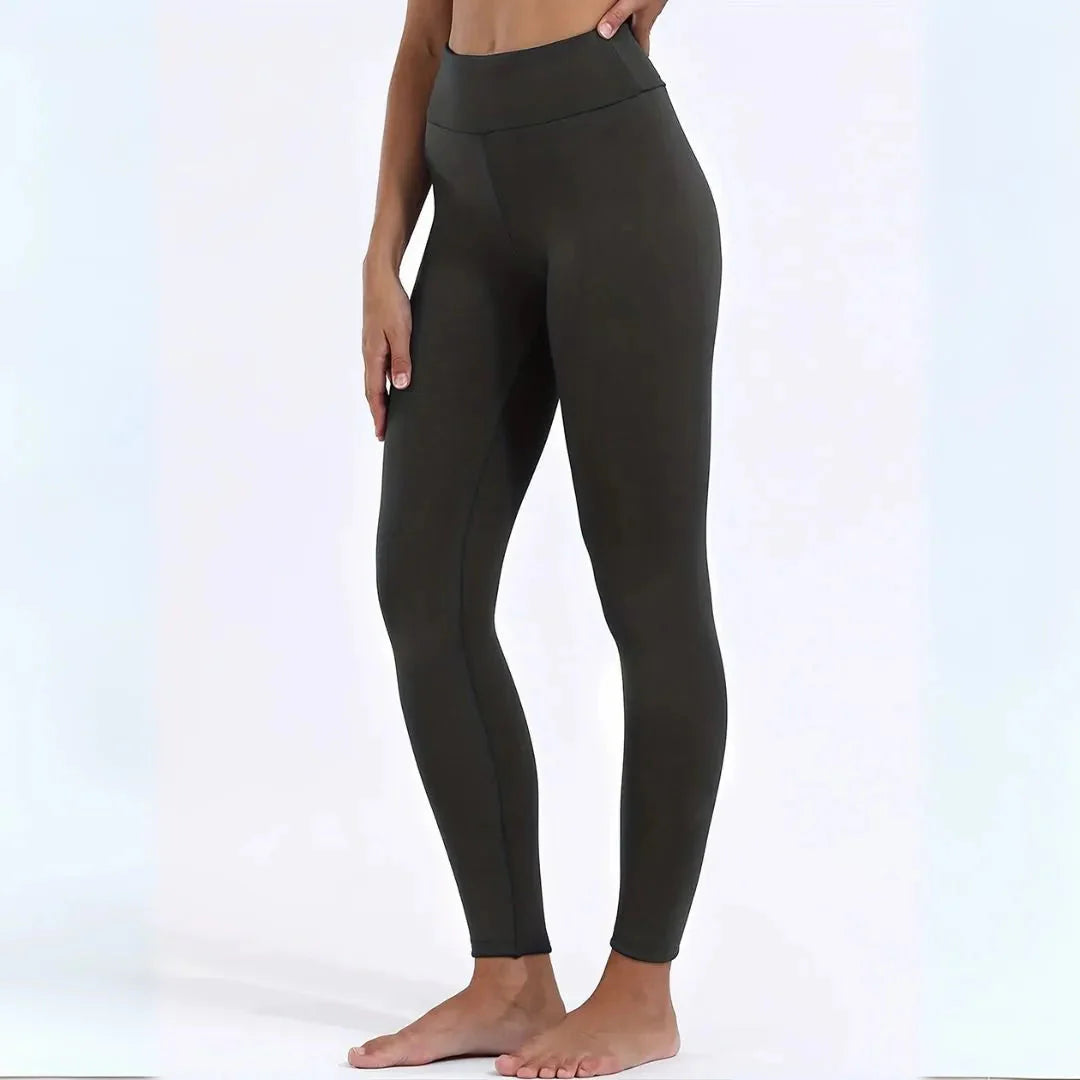 Women's black high-waist thermal fleece-lined leggings with tummy control for cold-weather comfort