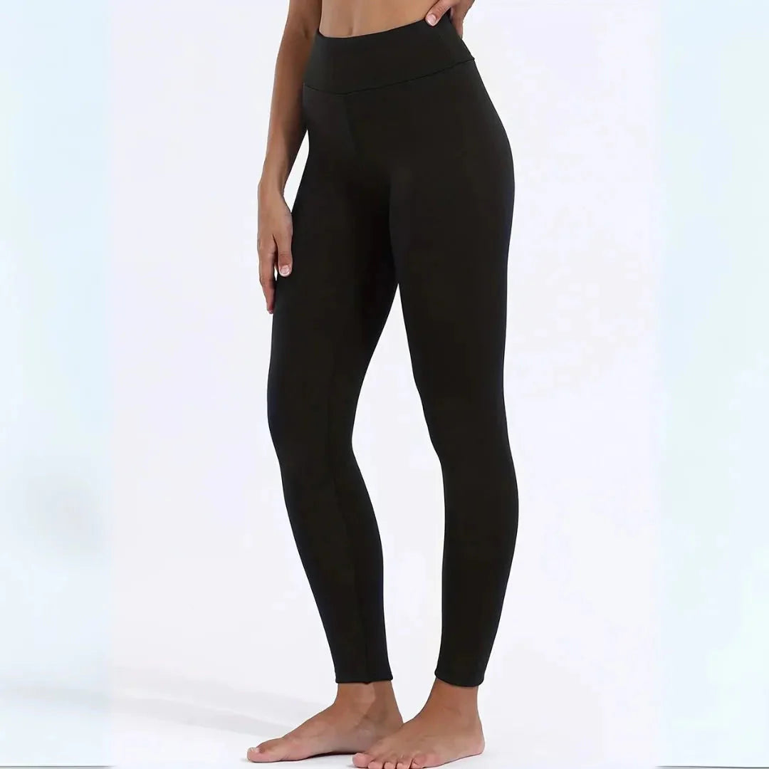 Women's black high-waist thermal fleece-lined leggings with tummy control for cold-weather comfort