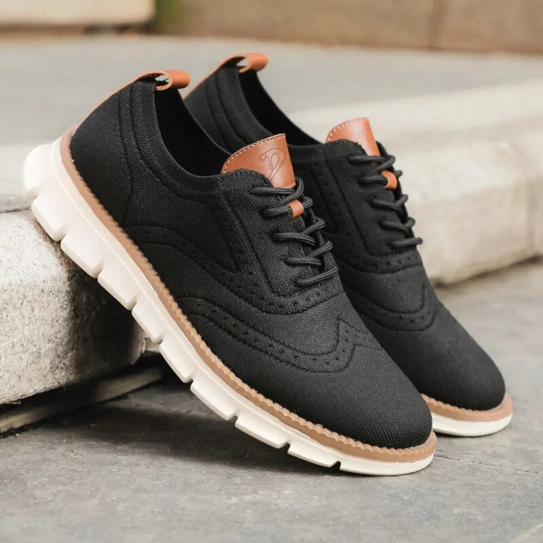 Men's white leather Oxford sneakers with classic wingtip detailing and sleek urban silhouette