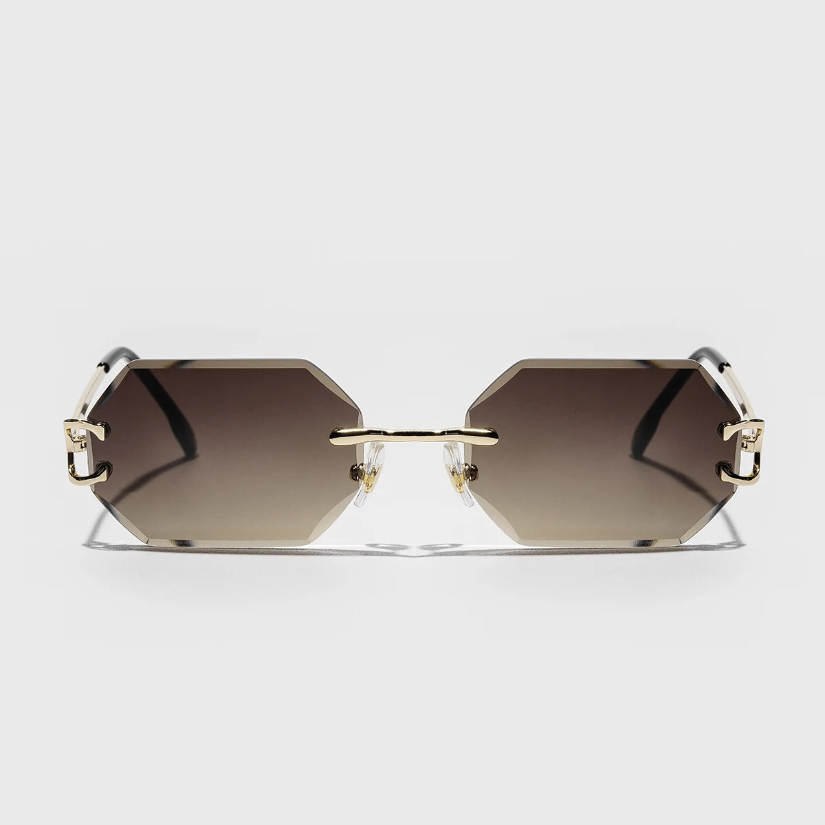 Rimless octagonal sunglasses silver metal temples precision-cut geometric lenses bold minimalist style