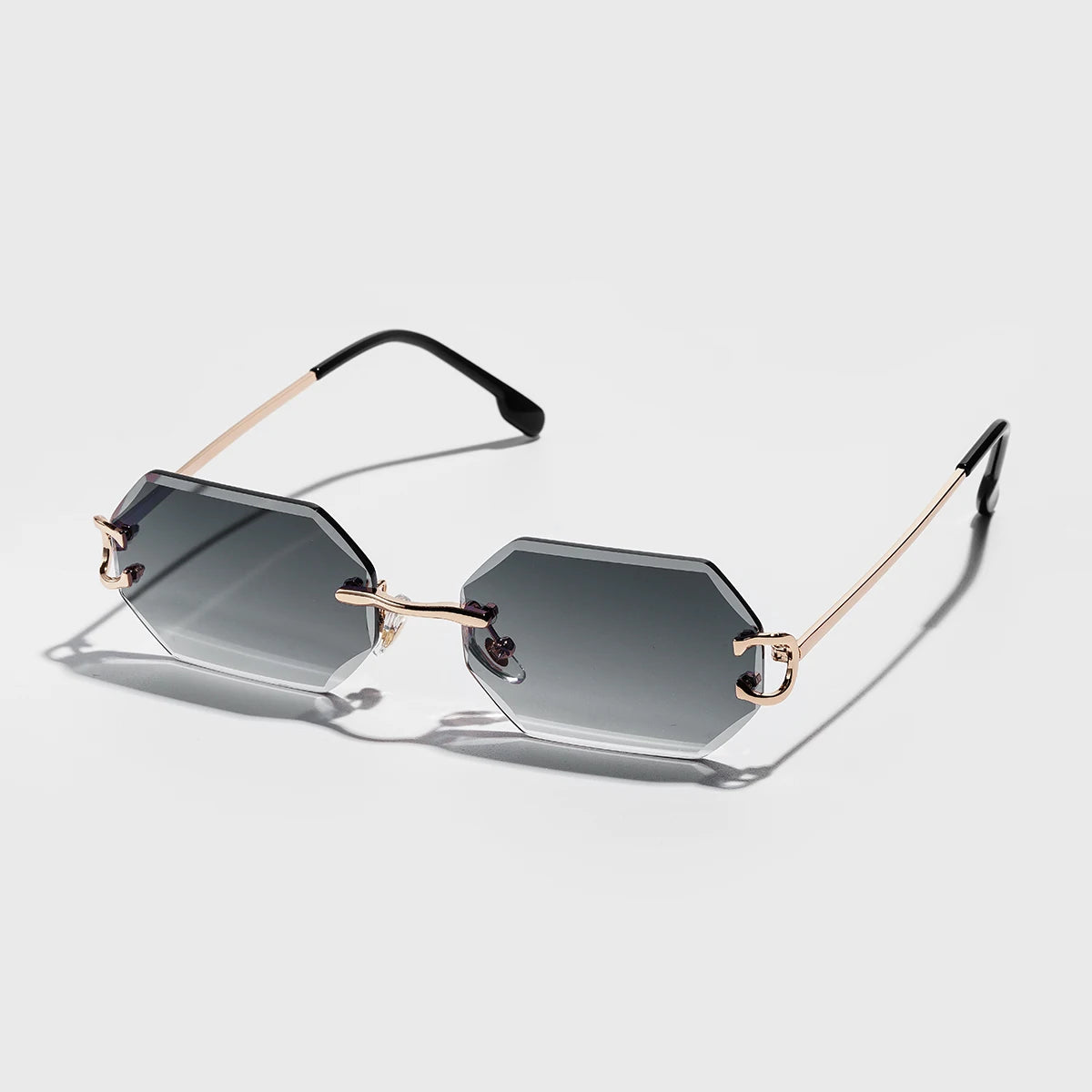 Rimless octagonal sunglasses silver metal temples bold geometric precision-cut lenses minimalist style