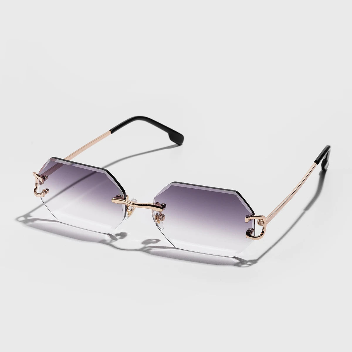 Rimless octagonal sunglasses silver metal temples bold geometric precision-cut lenses minimalist style