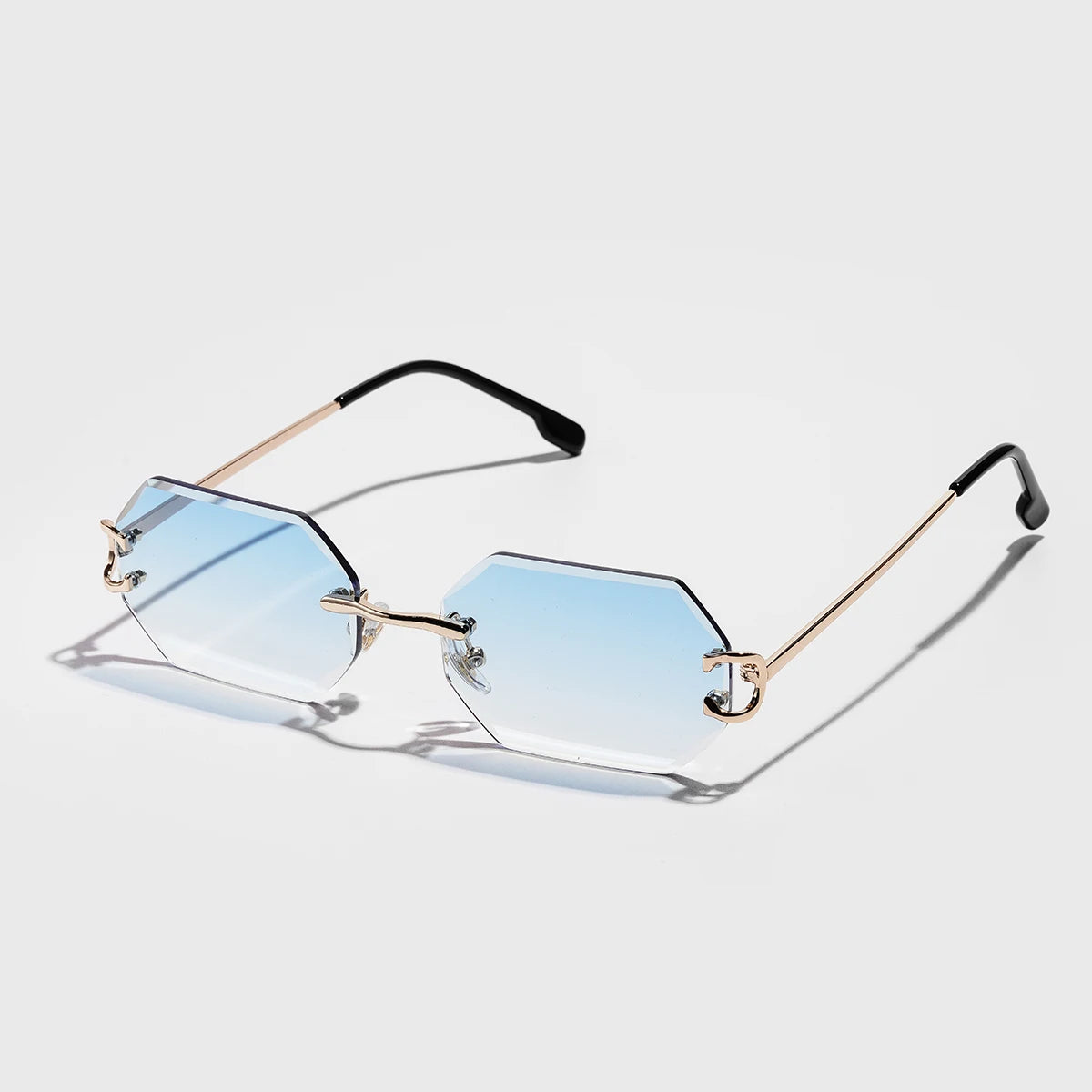 Rimless octagonal sunglasses silver metal temples bold geometric precision-cut lenses minimalist style