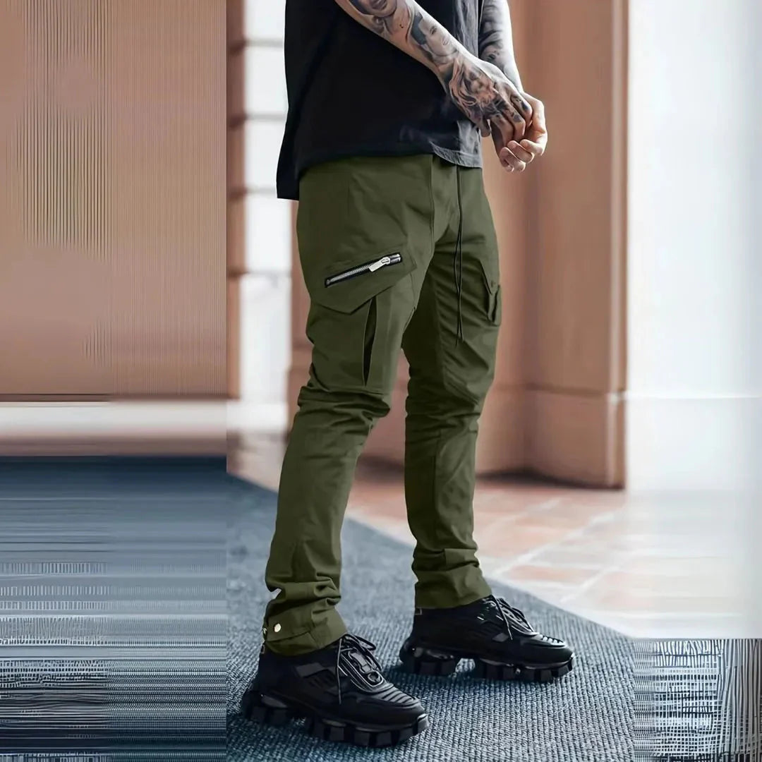 Black slim tapered cargo pants with exposed zips and multi-pocket streetwear design
