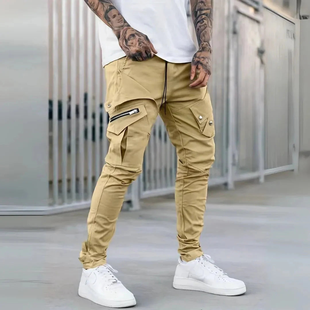 Black slim tapered cargo pants with exposed zips and multi-pocket streetwear design