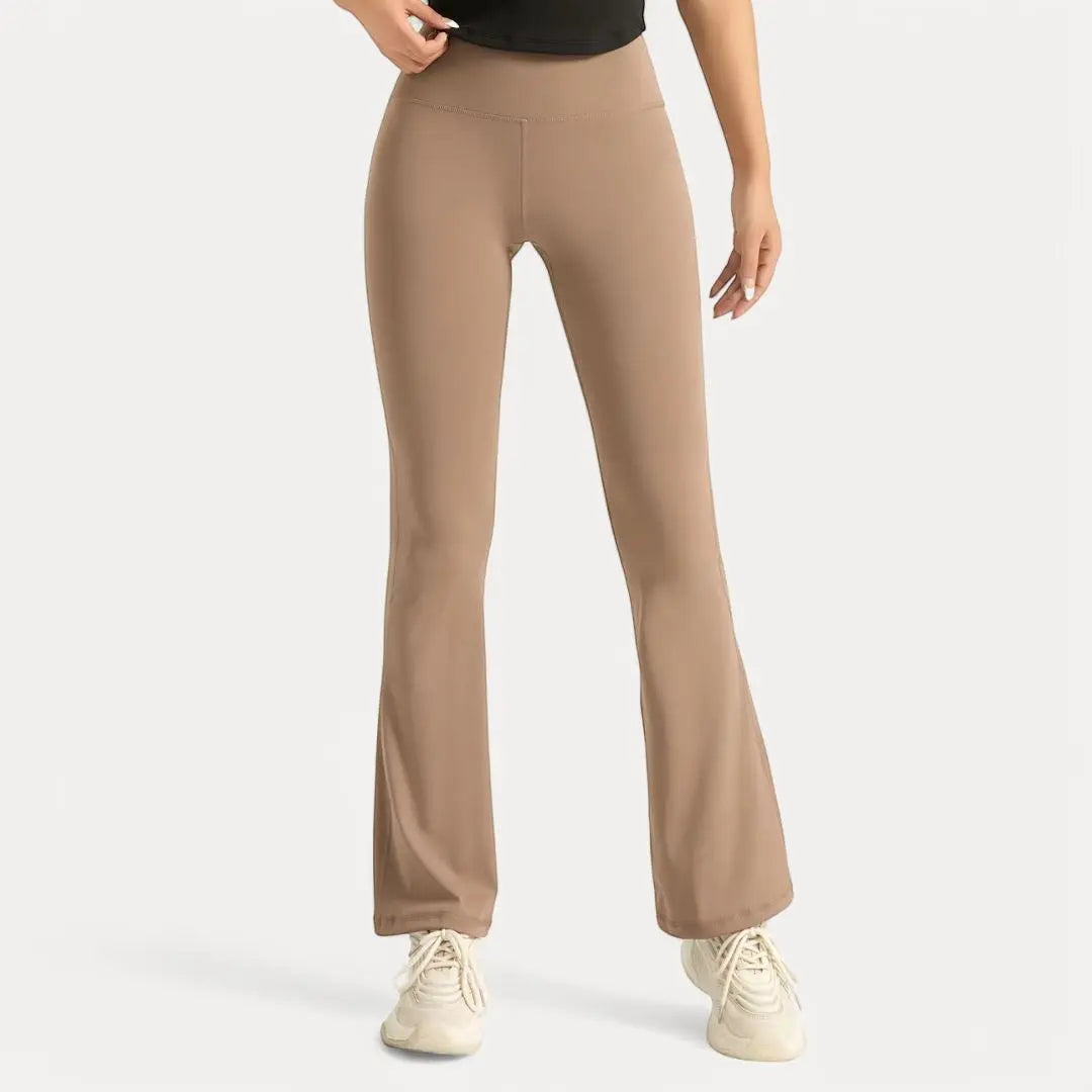 Black high-waist flare leggings with ultra-stretch moisture-wicking fabric and sculpted silhouette