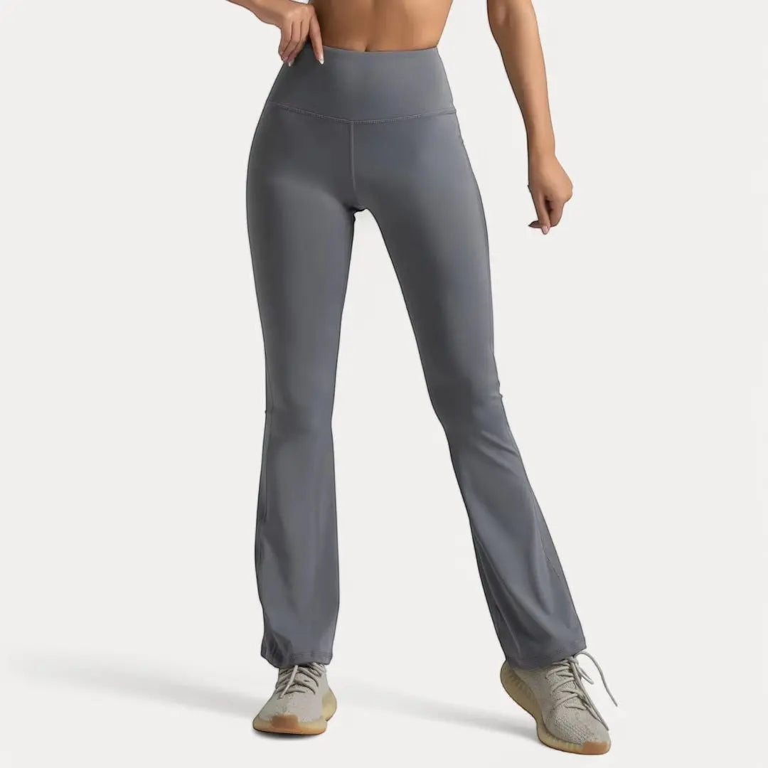 Black high-waist flare leggings ultra-stretch moisture-wicking fabric dramatic silhouette yoga