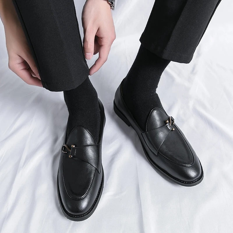 Men's genuine leather slip-on loafers in matte finish with sleek metal bit detail for professionals
