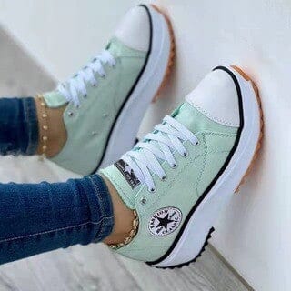 Women's white low-top canvas chunky sole sneakers with bold platform rubber outsole for everyday casual style