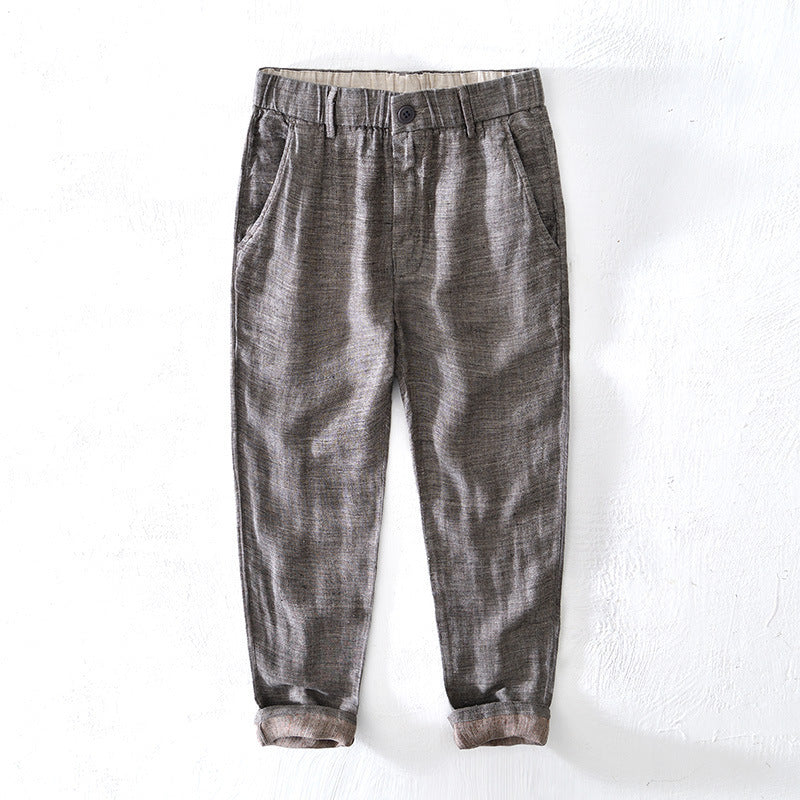 Lightweight linen tapered trousers with elastic waistband and rolled hem cuffs for casual wear