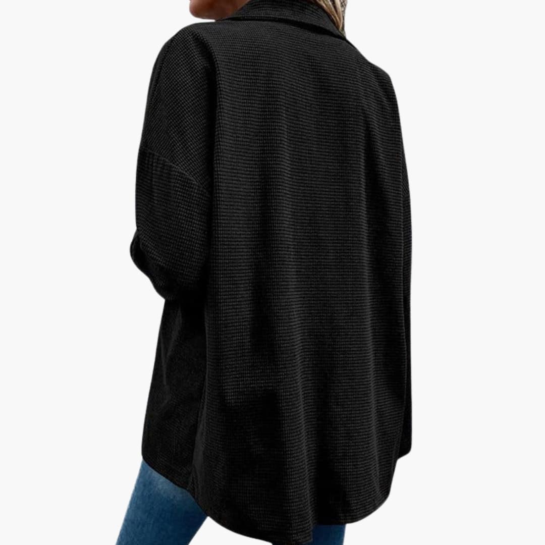 Women's brown ribbed shirt jacket with button closure, front pockets, and structured straight silhouette