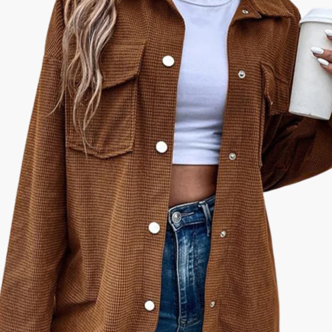 Women's brown ribbed shirt jacket with button closure, front pockets, and structured straight fit