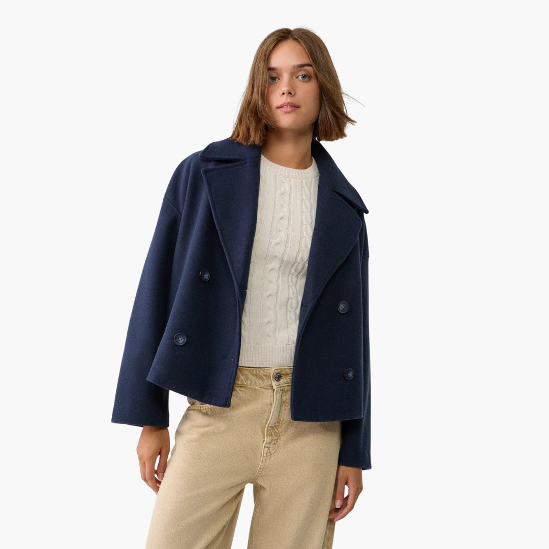 Women's double-breasted short jacket with notched lapels and welt pockets, tailored office-to-evening chic