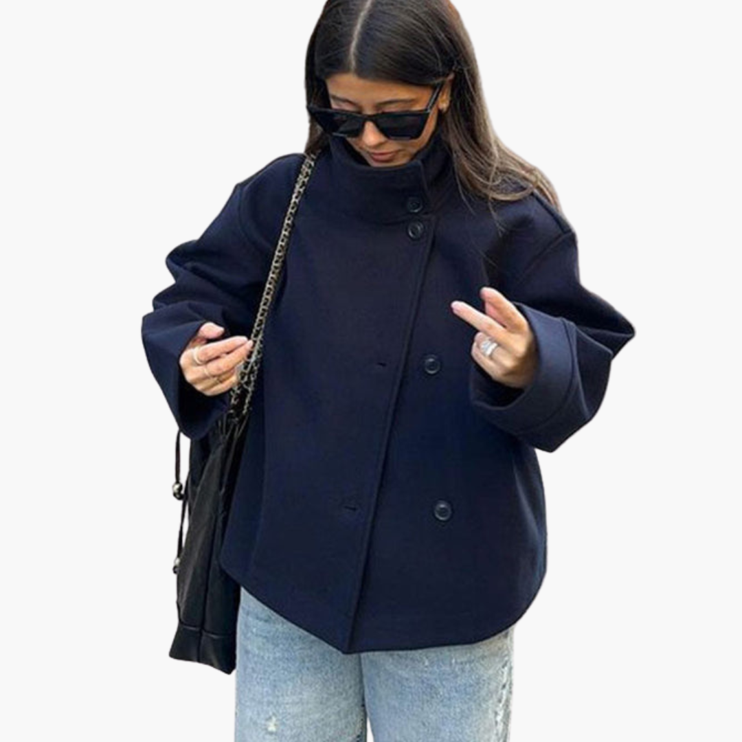 Women's short tailored jacket with wide lapel collar and front button closure in minimalist style