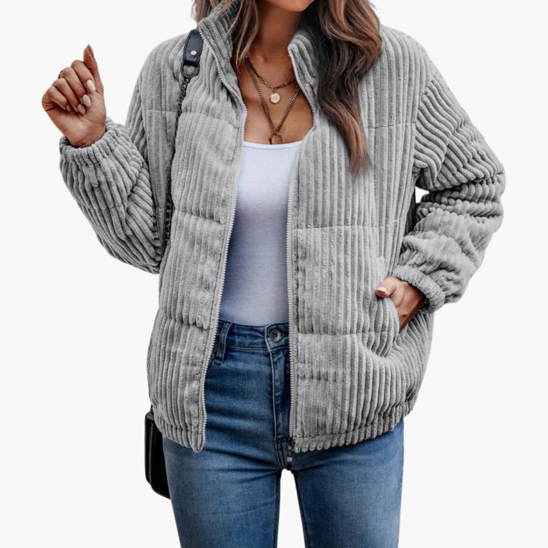 Women's green ribbed winter jacket with full-length zipper closure for cold weather warmth