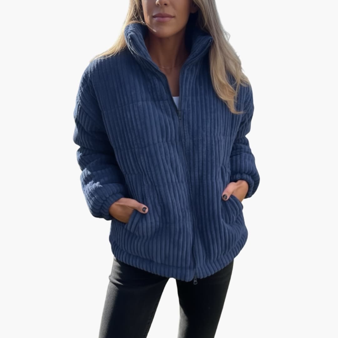 Women's green ribbed winter jacket with full-length zipper closure for cold-weather warmth and coverage