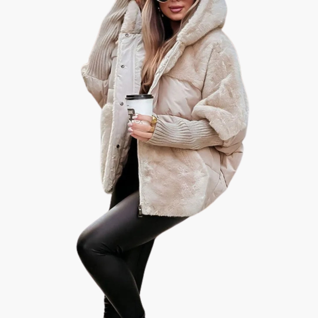 Women's black quilted hooded winter jacket with faux fur panels for layering warmth