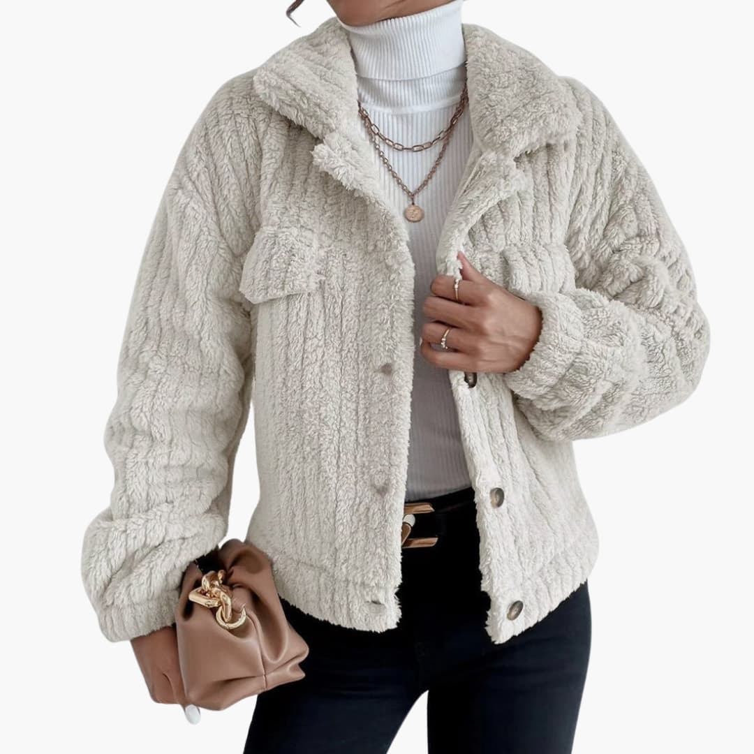 Women's short plush-effect jacket with button closure, pointed collar, and chest pocket for cozy chic style
