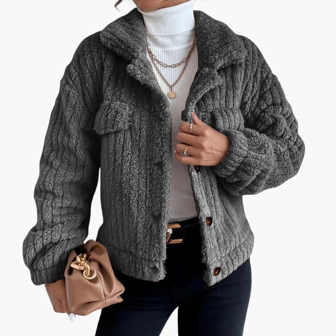 Women's short plush-effect jacket with button closure, pointed collar, and chest pocket for chic everyday style