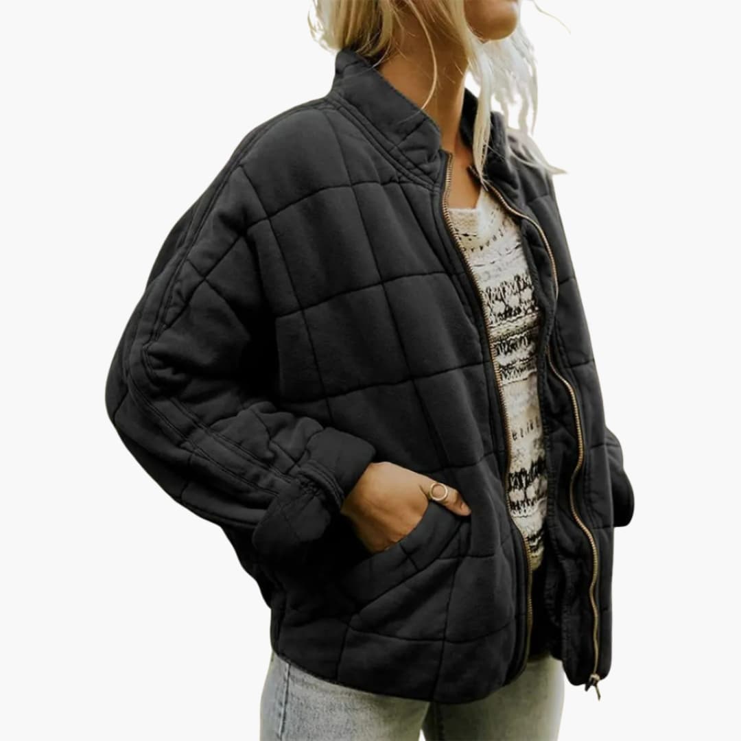 Women's autumn quilted jacket with stand-up collar, zipper closure, elastic hem, and side pockets
