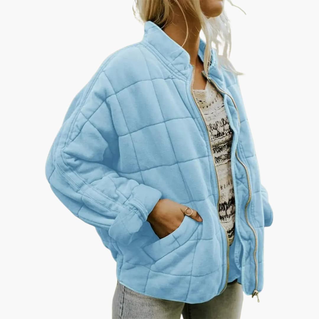 Women's autumn quilted jacket with stand-up collar, zipper closure, elastic hem, and side pockets
