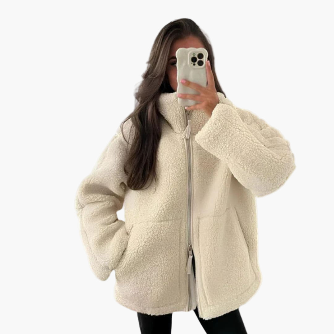 Women's plush zip-up jacket with stand-up collar, textured soft fabric and front pockets for cozy wear