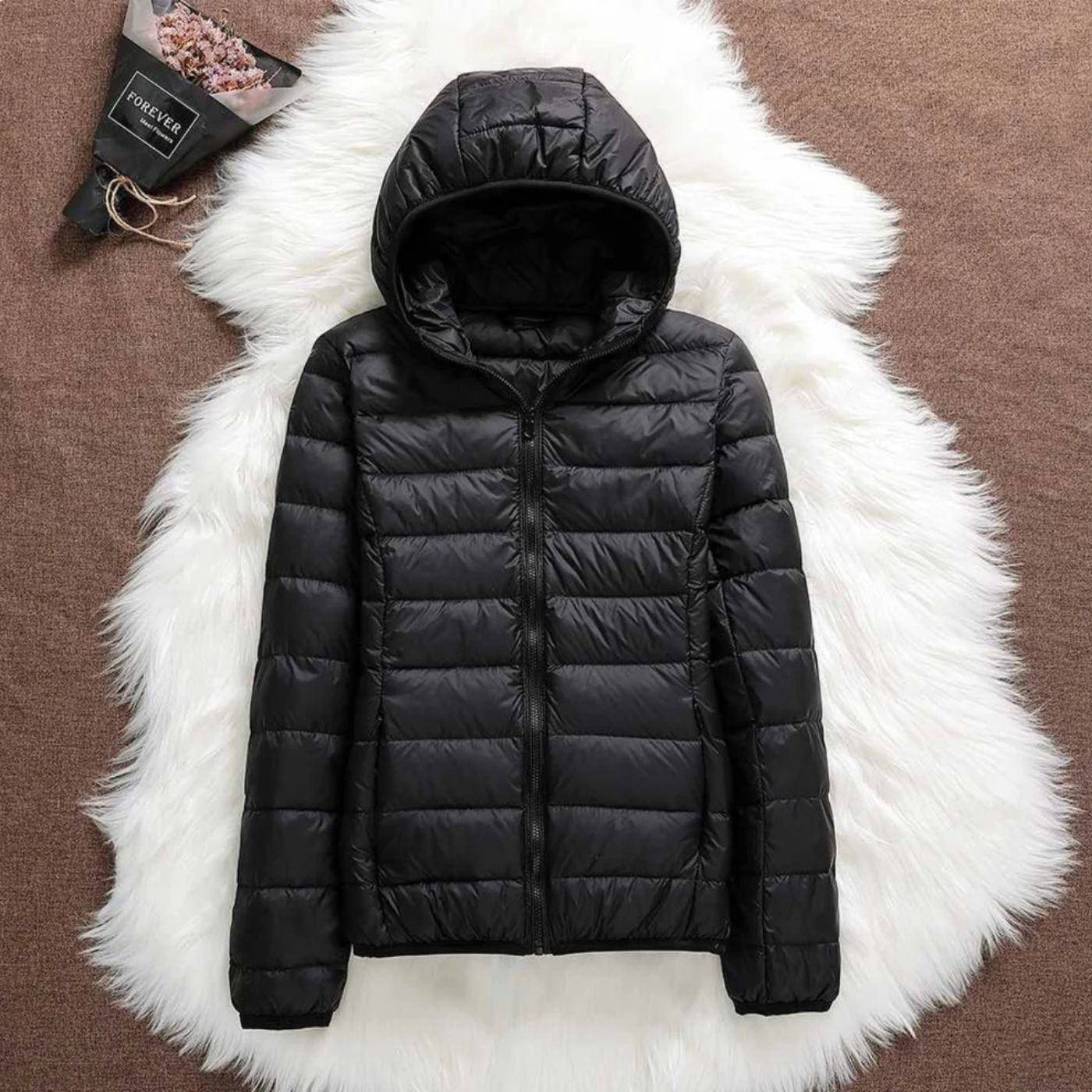 Lightweight quilted puffer hooded jacket in neutral tones, slim packable fit for outdoor wear