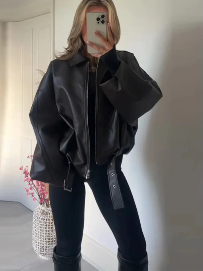 Women's brown vintage faux leather oversized bomber jacket with relaxed fit and belt detail