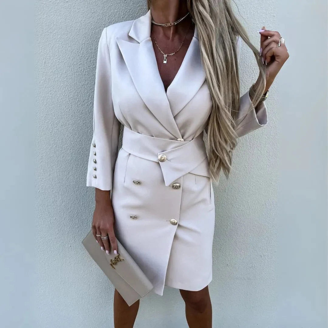 Women's black double-breasted blazer mini dress with gold buttons, padded shoulders, and sharp lapels