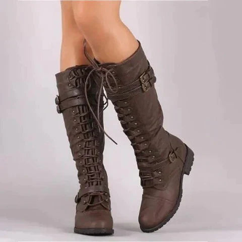 Brown knee-high lace-up boots with buckle charm details and side zipper, retro vintage style