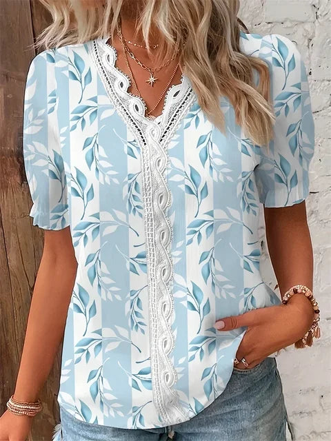 Women's floral V-neck blouse with delicate lace trim, elegant botanical print, breathable fabric for professionals
