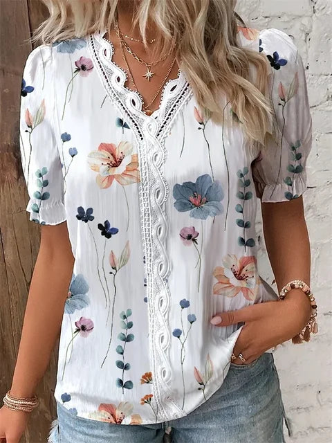 Women's floral V-neck blouse with delicate lace trim, elegant botanical print, breathable professional top