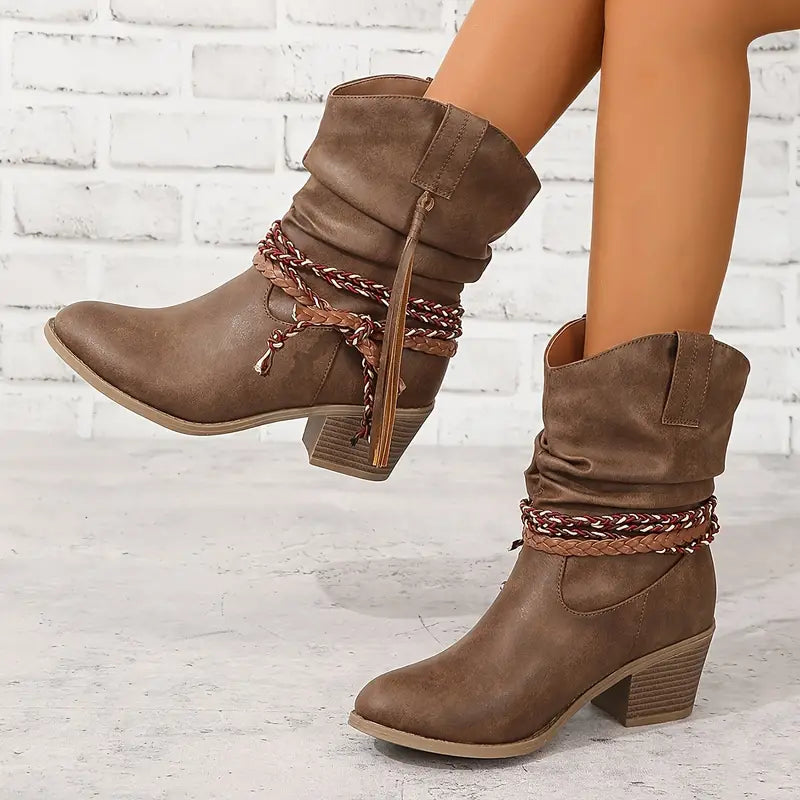 Women's brown suede-like cowboy boots with decorative lacing, boho fringe detail, and block heel