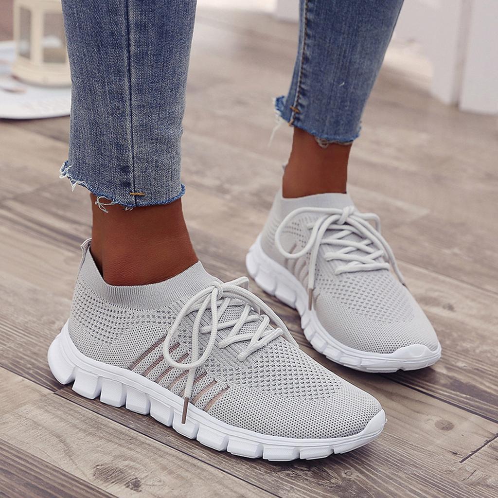 Women's breathable knit slip-on sneakers with decorative laces and cushioned shock-absorbing sole