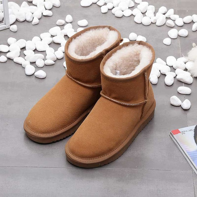 Women's brown suede ankle boots with plush interior lining and flat sole for cozy fall comfort