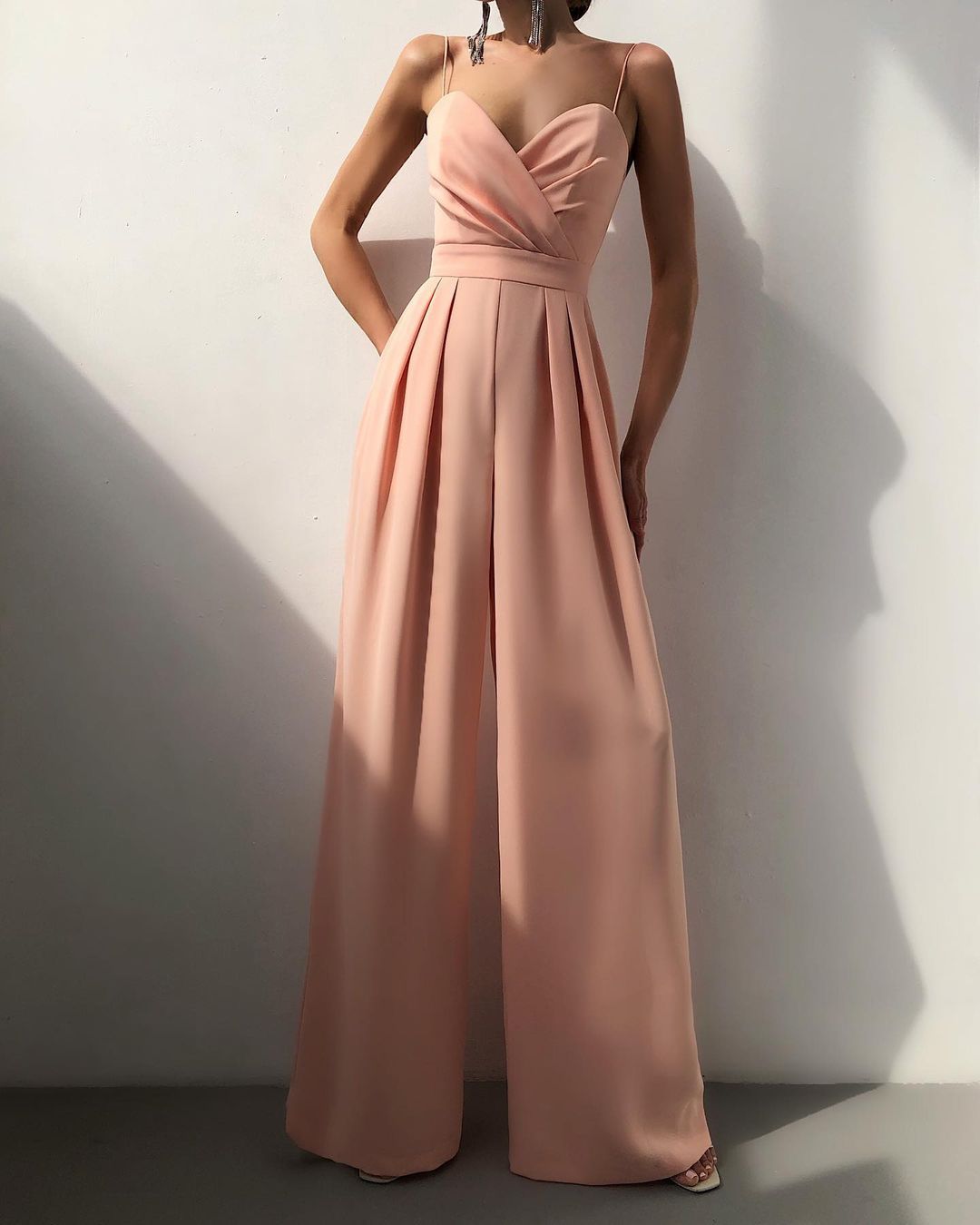 Livia black wide-leg jumpsuit with strappy neckline, elegant flowy silhouette for all-day wear
